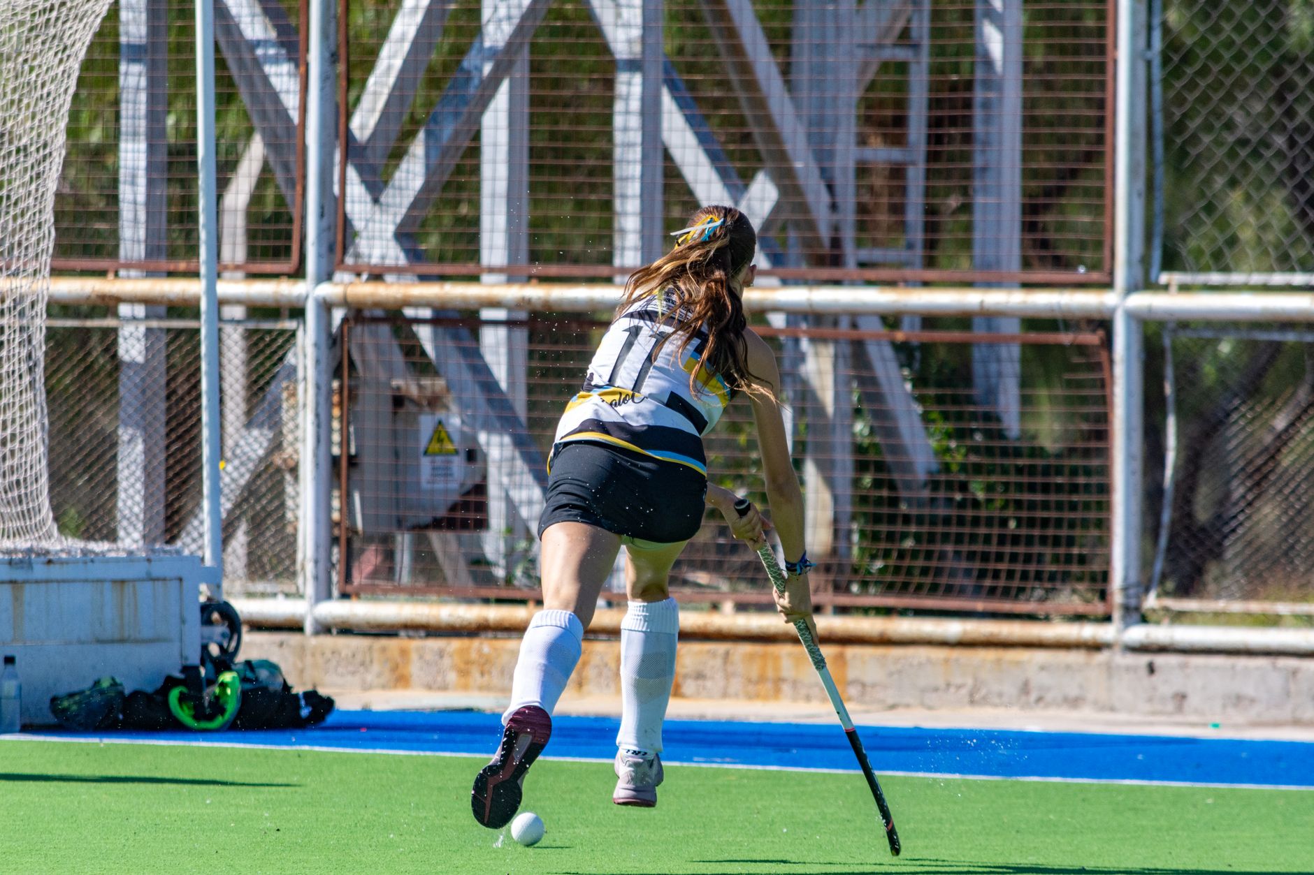 field hockey player in action mid game